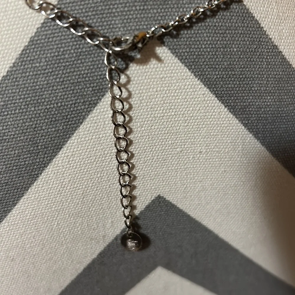 Kids 16” silver necklace with a 1.5” ballerina pendant. Gently used.